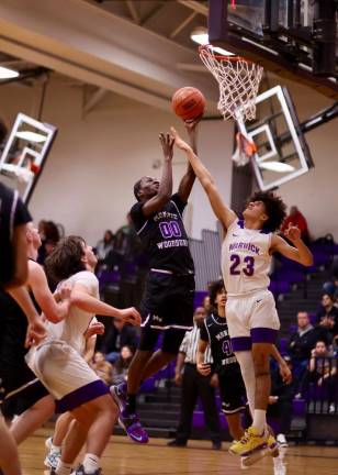 Fabrice Ndja, #00, drives to the basket in the second half.