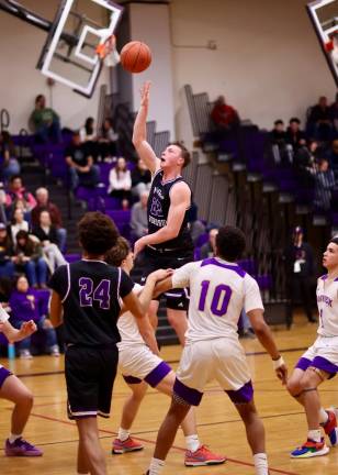 Kyle McDermott, #23, crashes through the Wildcats’ defense.