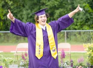 Kevin Patterson raises his arms at the 7:30 p.m. graduation ceremony held Friday, June 27, at C. Ashley Morgan Field in Warwick. Photos provided by WVCD.