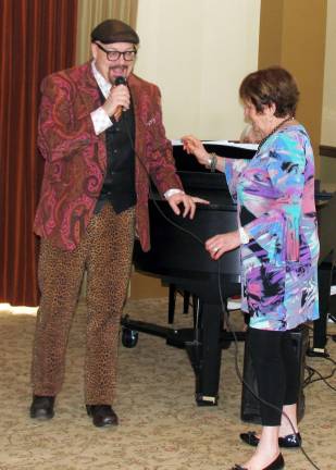 Fashion on display at Warwick Grove Photo by Roger Gavan After welcoming guest, Director of Sales Carole E. Rogers turned over the microphone to emcee Tim Mullally.