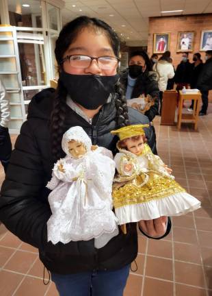 Maxine Torres, 10, from Warwick, displays her two dolls.