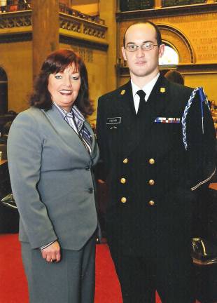 Warwick Valley High School graduate represents NY Maritime College in Albany New York State Assemblywoman Annie Rabbitt poses with Warwick Vakket High School graduate Carl Fischer, a student and chief indoctrination duty officer at the State University of New York (SUNY) Maritime College.