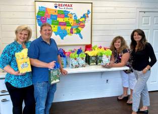 RE/MAX Town &amp; Country in Warwick is kicking off the beginning of the new school year with a variety of fun back-to-school gift bags filled with grade specific school supplies for students Kindergarten-4th grade. Pictured from left to right in the RE/Max Town &amp; Country office at 14 Main St. are: Jennifer DiCostanzo, Brian Cisek, Tiffany Megna and Luisa Jackson. Provided photo.