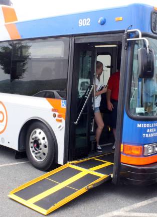 Town of Warwick acquires hybrid vehicle for Dial-A-Bus service The hybrid diesel-electric bus can accommodate 28 passengers and two wheelchairs. It is also fitted with a bicycle rack in the front. And the low floor design in the front of the bus includes a ramp, which can be extended for wheelchairs, providing a large vestibule for quick and easy entry, as shown here in this photograph provided by the Orange County Executive's Office.