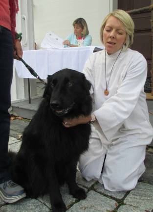 All God's creatures Provided photos Sugar Loaf United Methodist Church Pastor Susan Chupungco administers her blessing during last year's Blessing of the Animals. This year's service will be held on Saturday, Oct. 13.