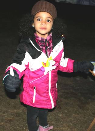 Community connections Photos by Roger Gavan Mya Joy Barbour, 5, was given the task of handing out candles out to the approximately 75 adults in the families that attended.