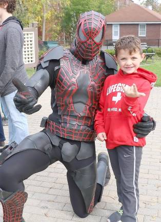 Matthew Corsi, 6, poses with Spiderman.