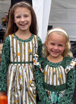 Applefest crowds exceed expectations and break records despite light rain The celebration of Applefest is a special day for Nicole De Gelman, 8, and her sister Niana, 5, from Highland Lakes, who always wear special dresses for the annual event.