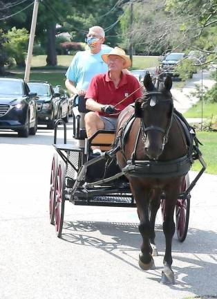 The parade featured a horse and buggy owned and driven by Fred Klepper.