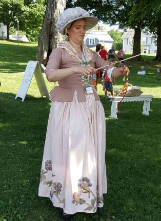 Revolutionary War living history summer meetings set for july 9 and Aug. 6 Courtesy photo Reenactor Cora Chandler demonstrates the game of Graces at a past Washington Day in Lewis Park.