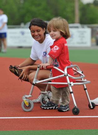 Subaru Share the Love Campaign raises $35,929 for Beautiful People Ball Field Miracle League: (field shot withboy and walker).