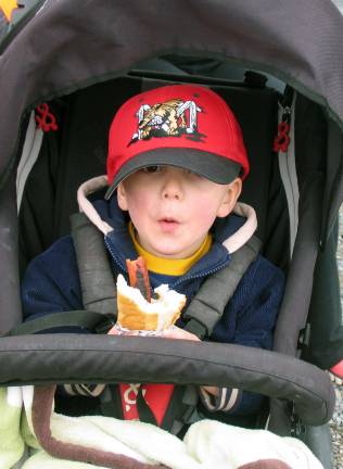 Warwick Little League celebrates opening day for 2014 baseball season Fortwo and a half year old Nico Green, baseball is all about enjoying a hot dog.