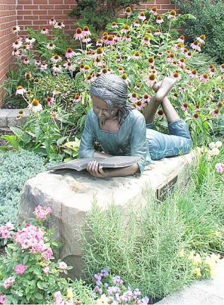 Maddy – The story of our statue: Friends and family of the late Madeline Rose Pillmeier dedicated a bronze statue in her memory on Saturday, May 15, 2010, at the Florida Public Library. The statue of a young girl reading a book was funded by an outpouring of donations to the library following the 15-year-old Florida student’s death in June 2009. She was an avid reader and a lifelong library user.