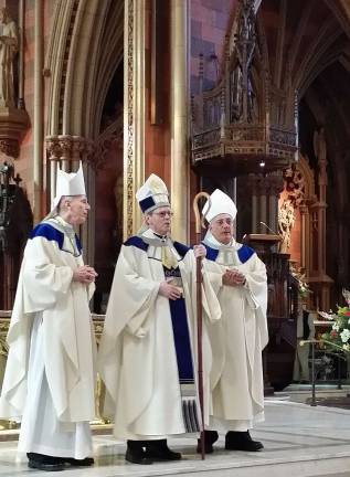 Warwick parents attend their son's installation as new Bishop of Albany Newly installed Bishop Edward Scharfenberger (center) is flanked by Bishop Howard Hubbard (left), bishop emeritus of Albany, and Bishop Nicholas DiMarzio (right), bishop of the Diocese of Brooklyn.