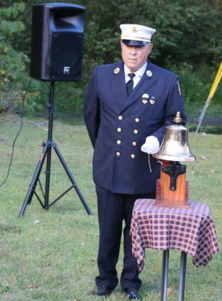 Everyone stood silently, heads bowed as Brasier read of the names of the local residents who perished in the attacks while Fire Department Past Chief Frank Fotino struck a ceremonial bell for each victim.