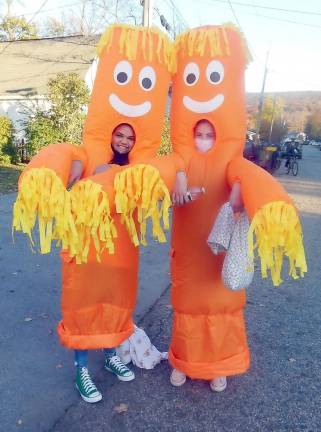 Orange tube dancers Hillary Surun and Alexa Hanna.