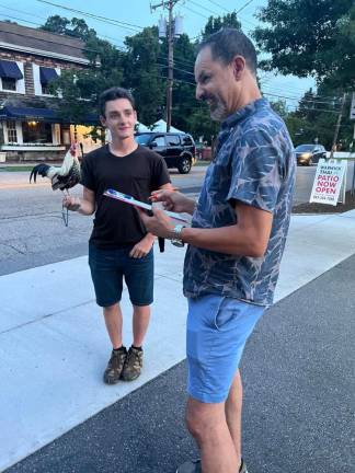 Johnny Gidney and Eric collecting signatures in Warwick.