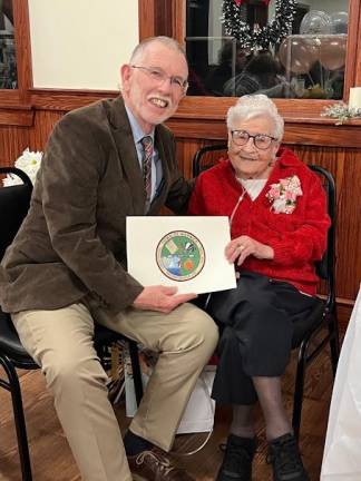 Warwick Supervisor Michael Sweeton presents Theresa Cassanite with a proclamation.