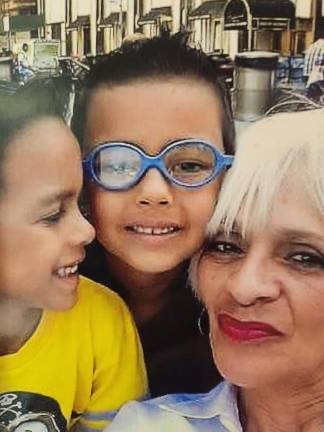 ‘That’s not my grandma, that’s my mom’ Ruth Barbosa, of Newburgh, and her grandsons, who call her Mommy. The boys are now teenagers. Barbosa is launching her own business, Spirit Care, to mentor people who are struggling to overcome trauma.