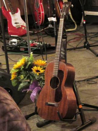Suzy Fest is a community success Two of Suzy's favorite things - her guitar and sunflowers.
