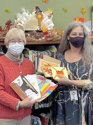 Meals on Wheels of Warwick chairman Jane Gareiss and Albert Wisner Library Teen Service Coordinator Karen Lee looking at Thanksgiving cards handmade by teen volunteers at the library. Photos provided by Debby Briller.