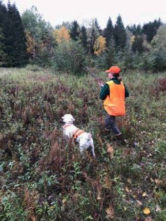 DEC announces 'WomenHuntFishNY' photo contest Photo provided by NYS DEC Mandy Baily and her lab Boone.