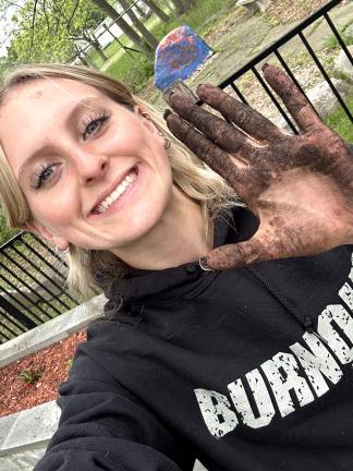 Seniors leave their mark with projects S.S. Seward senior Elizabeth Scheurmann replanted the District’s memorial garden.