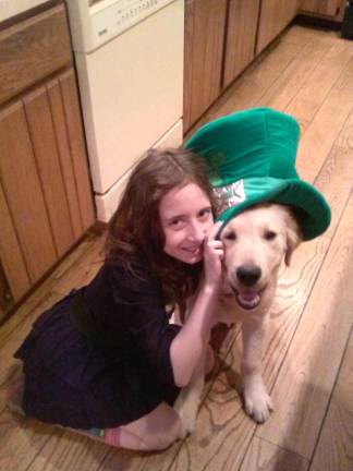 Celebrating St. Patrick's Day Cathy Leote of Greenwood Lake, N.Y. "Irish step-dancer Tyler and 5 month old Golden Retriever Biscuit celebrate Biscuit's first St. Patrick's Day."