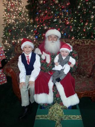 Vote for the best holiday photo Submitted by: Sharon Wareka of Hamburg, N.J. "Devin Lewis W. 8 years old and Darren Xavier W. 6 months old with the real Santa 2013"