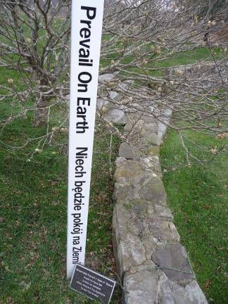 Peace Pole dedicated at Sanfordville Elementary The six-feet tall, four-sided poll is inscribed with a peace statement in eight languages.