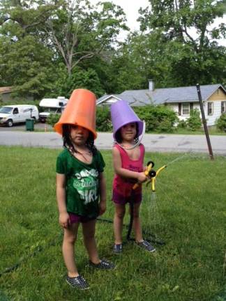 One Lucky Leprechaun My summer Leprechaun's. The twins pretending they were leprechauns. The pails were their hat. The sprinkler was their rainbow. Photo courtesy of Cindy.
