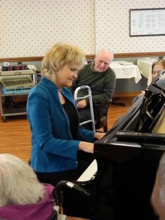 Discover the Hidden Gifts of Alzheimer's at Elant Elant at Meadow Hill residents listen as Marilynn Garzione plays the newly donated baby grand piano earlier this year. Garzione returns in September to speak about her experience as caregiver to her husband with Alzheimer's.