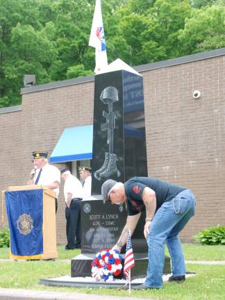 Greenwood Lake remembers and honors During Greenwood Lake's outdoor Memorial Day service, James Lynch placed a wreath at his son's statue. His son, Marine Lance Cpl. Scott A. Lynch, was killed in action in 2010 while deployed in Afghanistan.