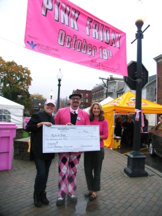 Pink Friday fund-raising success Photo by Roger Gavan During the evening, Tim Mullally, chairman of Pink Friday, presented a $1,500 ceremonial check, representing a gift from the Merchants Guild, to Dana Effroni (right), co-founder of Miles of Hope, and the organizationís Executive Director Pari Forood.