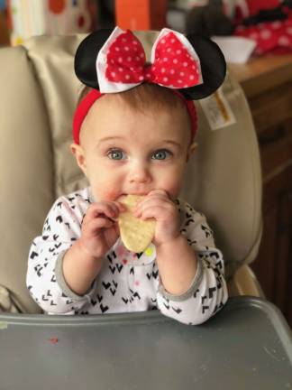 One Lucky Leprechaun FIRST FOODS. CHARLOTTE EATING HER FIRST CHIP. Photo courtesy of Lynn.