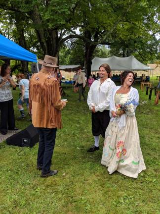 Hundreds gathered at one of America's longest-held family reunions Michael Brown re-acted the role of traveling minister while other cousins played the role as Sarah Wells and William Bull. Photo by Julie Boyd Cole