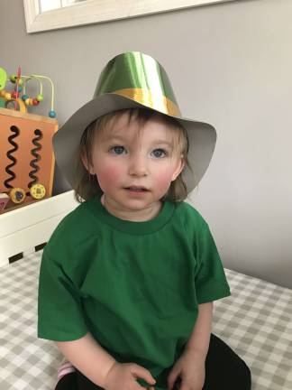 One Lucky Leprechaun Grace in her leprechaun hat and Grace being her happy self