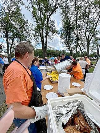 Dozens of volunteers cooked and served and cleaned up.