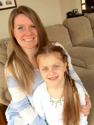 Mother Daughter Look A Like contest Photo submitted by Lara Anderson of Chester Kate and Lara Anderson. "Yeah, she looks like me but she's really my "mini-me" in her attitude. Her dad and her brothers have their hands full."
