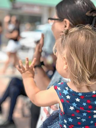 Photos: Celebrate America Parade in Greenwood Lake Brayleigh Conklin and her mother, Chelsea, of Greenwood Lake wave at her father, a firefighter in the Celebrate America Parade on Saturday, July 5. (Photos by Denise von Wilke)