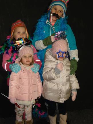 Ring in 2018 with New Year's Eve events around the county Goshen's ball drop party has an early party for kids along with the countdown at midnight for adults. Pictured at the party last year are sisters Anna and Lea DiGiovanni (in the rear) with their cousins, Emma and Adeline DiGiovanni, who are also sisters. All the children live in Goshen. (Photo by Geri Corey)