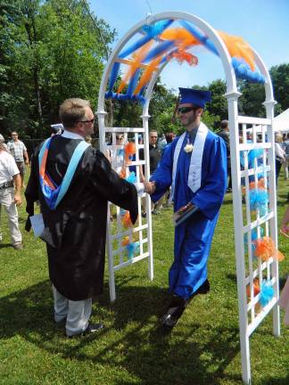 S.S. Seward Institute Class of 2014 After walking off the stage to the song "Free Bird," students received one final congratulations from Principal Michael S. Rheaume. Friends and family applauded as their graduates walked through the arch, finalizing the commencement ceremony.