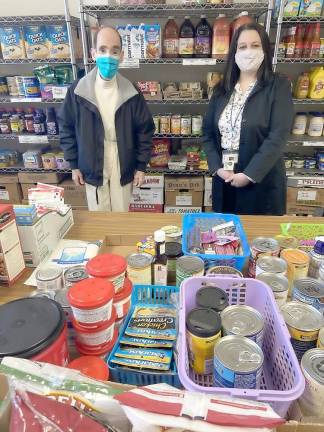 Glenn P. Dickes, the director of the Warwick Ecumenical Food Pantry, is pictured here with Lisa Bacenet, the coordinator of volunteers for the Warwick Friendly Visitor Program. Provided photo.