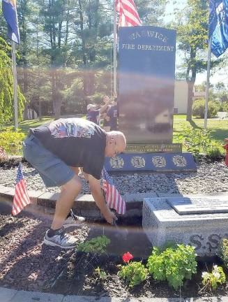 Past chief and 61-year department member Frank Fotino readies the WFD Monument for 9/11 services scheduled for this Friday evening at 6 p.m. in Memorial Park.