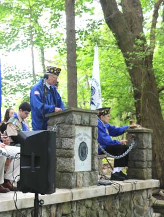 The tradition continues In a touching moment, and assisted by Navy veteran Ed Hodas, Second Vice Commander Jerry Schacher read the names of all the comrades who had past away since last year’s ceremonies.