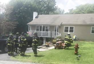 Warwick firefighters secure the scene of a residential gas leak in the Village of Warwick last Saturday afternoon. Photos by Michael Contaxis, 1st Assistant Fire Chief.