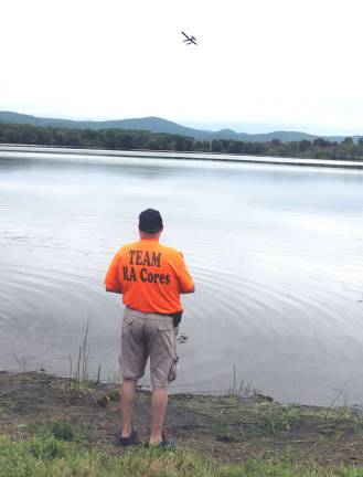 Warwick airport hosts seventh annual 'Electric Fun Fly' Steve Wattenberg controls his Pilatus PC-6 seaplane model from the shore of Wickham Lake.