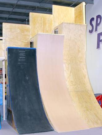 The warped wall is just one of the obstacles on the Warrior Zone course. Participants have to get a running start, run up the wall, grab the edge at the top of the wall and pull themselves onto the platform at the top. The walls are 11-feet, 13’-feet and 15-feet tall, left to right. The tallest is the same height as the one they use on the TV show American Ninja Warrior.