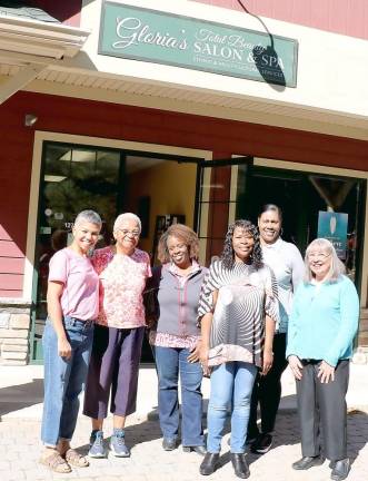 On Saturday, Oct. 12, Gloria Washington-Mines invited her staff, clients and friends to join her for refreshments and an opportunity to visit her salon, Gloria’s Total Beauty Salon &amp; Spa, for one last time. “They are all family,” she said. Washington-Mines (third from right) poses with a group of early arrivals.