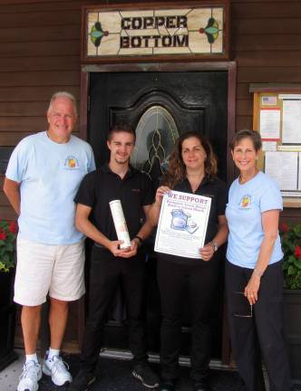 No child left hungry Photo by Roger Gavan Among Backpack Snack Attack's biggest supporters is the Copper Bottom Restaurant in the Village of Florida. Backpack Snack Attack volunteers Len Singer (left) and Arlene Neiman (far right) deliver fund-raising materials to Copper Bottom manager Nancy Mazany and her son Matthew, a member of the staff at Copper Bottom. Copper Bottom owner Marco Solari was not available for the photo.